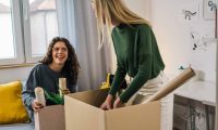 Students pack boxes ready to leave their accommodation
